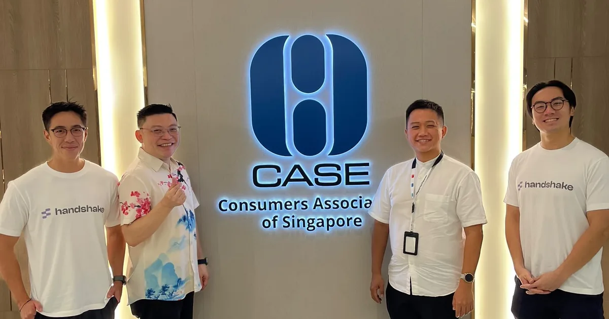 Handshake team members with CASE staff at the Consumers Association of Singapore office